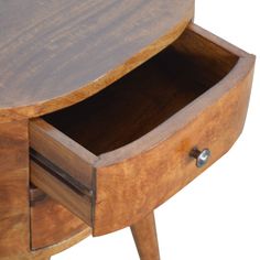 a wooden table with two drawers on one side and an open drawer on the other