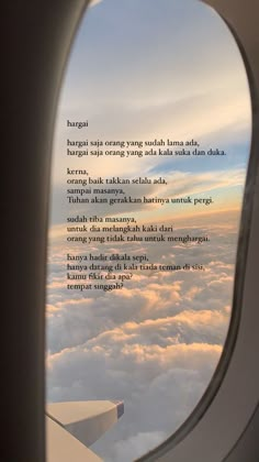 an airplane window looking out at the clouds and sky with a poem written on it