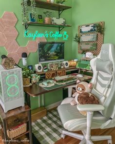 a desk with a computer and stuffed animal on it