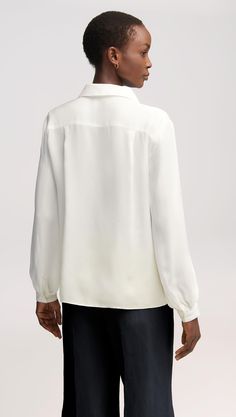 Here’s what happens when an everyday item piece gets an elegant twist. Made of airy Georgette silk, this versatile blouse features bubble sleeves, smart cuffs, and a relaxed fit for effortless layering. Pair with wide-leg trousers, heels, and bold accessories for a classy look that never misses. Office Blouse With Blouson Sleeves, Cream Silk Top For Workwear, Cream Blouse With Blouson Bishop Sleeves, Silk Long Sleeve Blouse For Layering, Silk Cream Top For Office, Cream Silk Top For Office, Classic Formal Tops With Gathered Sleeves, Chic Cream Tops With Blouson Sleeves, Chic Silk Blouse With Bishop Sleeves