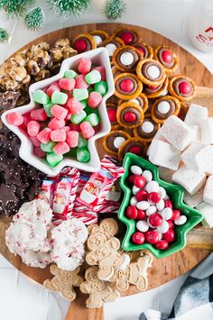 a wooden platter filled with christmas treats