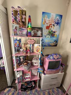 a room filled with lots of toys and other items on top of a book shelf