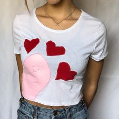 This super cute, lightweight, unique Baby Tee is perfect for everyday outfits! Design is hand-sewn onto a blank top by me. If you're looking for a fun and unique top, this shirt is perfect for you! Only 1 available! 💗Free 3 day US shipping  💗Handmade & One of a kind 💗52% cotton + 48% polyester  Sizing: Height: 17.5"    Chest: 17" CARE INSTRUCTIONS: Wash inside out, machine wash warm, tumble dry low, medium iron.  💗You may also like💗 Halleys comet baby tee: https://www.etsy.com/listing/13263 Fitted Patchwork T-shirt For Spring, Cute Fitted T-shirt With Heart Graphic, Fitted Pink T-shirt With Heart Graphic, Fitted Casual T-shirt With Heart Graphic, Pink Cropped Cotton Top, Summer Cotton T-shirt With Heart Print, Cute Cropped Cotton T-shirt, Fitted Heart Print Top For Summer, Fitted Summer Top With Heart Print