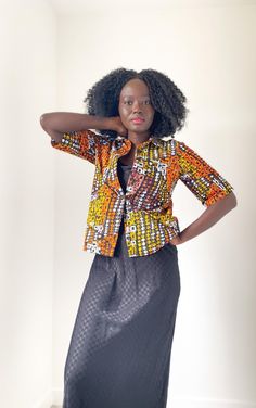 African wax fabric shirt, made for easy and comfortable fit. Perfect for multi-functional styling. From formal to casual; styled with heels or sneakers, the Circ Crisp will be the statement piece of the outfit. 60 cm long Model is a size 8, wearing a size Small (8-10) Material. 100% Cotton Care - Hand wash or wash under 30. Iron on low heat Made in Scotland Trendy Orange Cotton Blouse, Orange Cotton Button-up Blouse, Orange Cotton Blouse For Work, Orange Button-up Cotton Blouse, Casual Printed Office Shirt, Casual Office Shirt With Graphic Print, Cotton Button-up Blouse With Graphic Print, Fall Office Wear Cotton Shirt, Cotton Relaxed Fit Shirt For Office