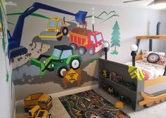 a child's bedroom with construction themed wallpaper