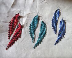 seed bead fringe earrings in several colors. colors are purple, green, blue, and red with black. Handmade by me. very long, but lightweight On surgical steel earwires. additional items ship free. Seed Bead Fringe Earrings, Bead Fringe Earrings, Bead Fringe, Beaded Jewelry Diy, Jewelry Diy, Purple Green