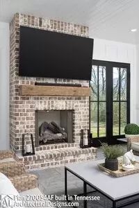 a living room filled with furniture and a flat screen tv mounted on the wall above a fireplace