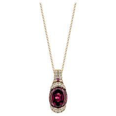 Sunita Nahata showcases an exquisite diamond studded Rubellite pendant that exudes grace and elegance. This exquisite 18 Karat rose gold pendant is ideal for any special occasion because it combines traditional elegance with modern flair. Rhodolite Pendant in 18Karat Rose Gold with White Diamond. Rhodolite: 3.46 carat, 10X8mm size, oval shape. Rhodolite: 0.02 carat, 1.50mm size, round shape. White Diamond: 0.08 carat, 1.30mm size, round shape, G color, VS clarity. White Diamond: 0.04 carat, 1.00 Rose Gold Pendant, Naha, Diamond Studs, White Diamond, Oval Shape, Gold Pendant, Round Shape, Or Rose, Fine Jewelry