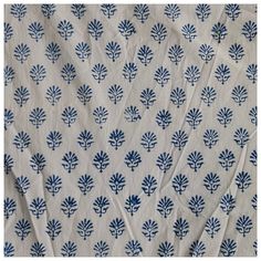 an old blue and white cloth with small flowers on the front, as if it were from india