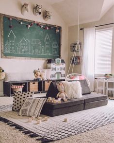 a living room filled with lots of furniture and decor on top of carpeted flooring