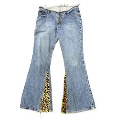 Vtg 90s Mudd Flare Bellbottoms Custom Leopard Fur Print Jeans Low Rise Size 9/11 Condition: These are a custom piece. The waist band was cut off to make them low rise and panels were added with a fuzzy leopard print fabric. There is a faint discolored spot on the seat and the belt loops were removed leaving small holes near the waist that should be an easy patch up. Overall very cool piece. The size tag was removed but measures comparable to a vintage 9/11 size, but please see measurements to ensure a proper fit. Measured flat unstretched. Double the measurements for complete circumference. Waist 16.5" Hips 18.5" Rise 9" Inseam 33 " Please see photos. Ask any questions before purchasing. Leopard Print Fabric, Low Waist Jeans, Jeans Low Rise, Print Jeans, Jeans Low, Y2k Jeans, Printed Jeans, Womens Jeans, Low Waisted