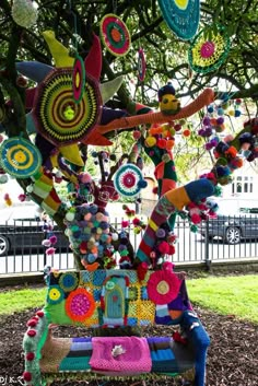 a bench covered in lots of colorful items