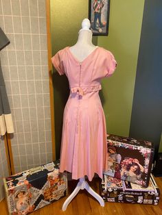 "Adorable 1950's light pink dress with silver studs and rhinestones around the waist! Bow in front and in back over the metal zipper So lovely and ready for a party Women's medium Bust: 37\" Waist: 28\" Hips: free Shoulder to hem: 43\"" 1950s Fitted Prom Dresses, Pink Party Dress With Fitted Waist, 1950s Style Pink Tea-length Dress, 1950s Style Spring Prom Dress, Vintage Pink Dress With Fitted Bodice For Spring, 1950s Style Pink Party Dress, Spring Pink Vintage Dress With Fitted Bodice, Pink 1950s Style Dress For Spring, Retro Pink Dress With Fitted Bodice