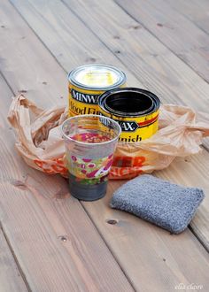 the perfect formula for warm weather gray stain is on top of a wooden table next to a can of paint