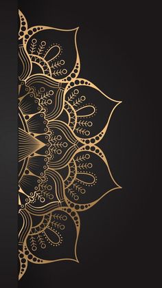 a black and gold wallpaper with an intricate design on the back ground, in front of a dark background