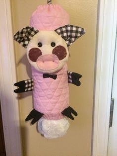 a stuffed animal hanging from the side of a door