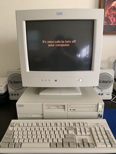 an old computer sitting on top of a desk