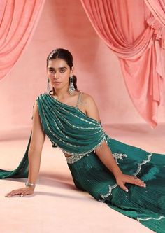 Embellished draped choli with tassels, paired with an embellished tiered skirt. Lehenga Drape, Simple Lehenga, Dresses Traditional, Lehnga Dress, Punjabi Outfits, Women Blouses Fashion, Designer Blouse Patterns, Simple Pakistani Dresses, Design Clothes