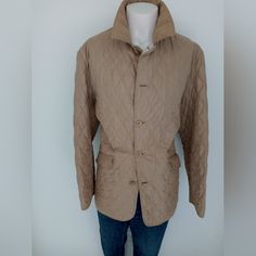 This Is A Beautiful Tan Quilted Jacket For The Stylish Man Who Wants Comfort And A Great Look To Complement Jeans And Boots. This Is A Size Large And Has Slanted Pockets Accompanied With A Button Vent Closure In The Back. I Will Take Offers That Are Reasonable As This Is A New And Never Worn Jacket. Also All Of My Items Are From A Smoke And Pet Free Environment. Measurements Are Upon Request. Classic Quilted Outerwear For Work, Classic Quilted Jacket For Winter Workwear, Classic Quilted Sport Coat For Fall, Classic Winter Quilted Jacket For Workwear, Classic Brown Quilted Jacket For Fall, Classic Quilted Outerwear For Cold Weather, Brown Quilted Outerwear For Work, Beige Padded Collar Outerwear For Work, Classic Brown Utility Jacket For Spring