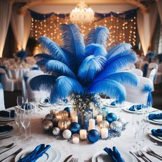 a table set with blue and silver decorations