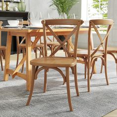 a dining room table with chairs around it