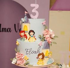 a birthday cake with princess characters on it