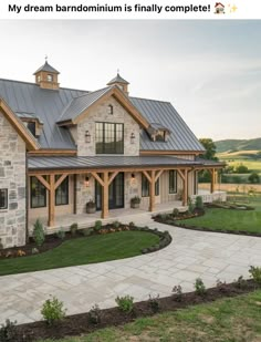 a large stone house with a metal roof