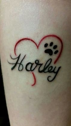 a small tattoo with the word harley written on it and a paw in the shape of a heart