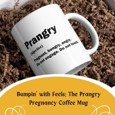 a coffee mug with the words prangry on it in front of a pile of coffee beans