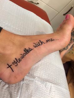 a person with a tattoo on their foot that reads, yeebahes with me