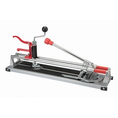 a machine that is sitting on top of a metal tray with red handles and two levers