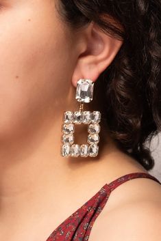 The earrings are crafted from durable metal alloy and have a gold or silver-tone finish. The combination of the rhinestone gems and the metallic finish creates a bold and eye-catching look. The earrings are lightweight and comfortable to wear, making them perfect for a night out or any special occasion. The post-back closure ensures a secure fit throughout the day. Size Height: 2.3 in (5.84 cm)Width: 1.25 in (3.18 cm) QualityThe post backings ensure a secure and comfortable fit, making these ear Earrings Outfit, Crystal Statement Earrings, Pearl Statement Earrings, Elegant Jewellery, Oversized Earrings, Female Human, Monogram Jewelry, Pierced Jewelry, Monogram Necklace