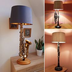 a lamp that is on top of a wooden table next to a musical instrument and a potted plant