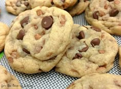 chocolate chip cookies are piled on top of each other