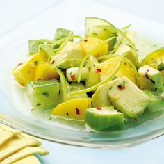 a glass plate filled with sliced up fruit