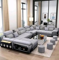 a living room filled with lots of grey furniture