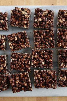 several squares of brownies with nuts on top