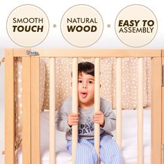 a little boy sitting in his crib with the words smooth, natural, wood