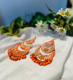 These gorgeous earrings will give any outfit an extra pop of color. Trendy Festival Drop Earrings, Orange Drop Earrings For Festive Occasion, Orange Dangle Earrings For Party, Trendy Handmade Earrings For Festive Occasions, Trendy Handmade Festive Earrings, Nickel Free Orange Earrings For Party, Orange Bohemian Earrings For Festive Occasions, Orange Drop Earrings For Festival, Traditional Orange Earrings For Party