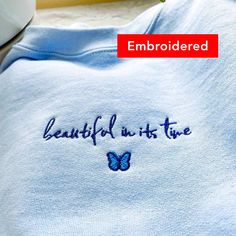 "*SIZES ARE UNISEX* -I'd suggest your usual size for a regular fit, or sizing up for a more relaxed fit. *these sweatshirts are extra comfy when oversized 🦋 \"beautiful in its time\" and a butterfly design embroidered on a comfy light blue crewneck. A sturdy and warm sweatshirt bound to keep you warm in the colder months. A pre-shrunk, classic fit sweater that's made with air-jet spun yarn for a soft feel and reduced pilling. Your new favorite sweatshirt! \"He has made everything beautiful in i Philippians 1 21, Light Blue Crewneck, Embroidery Crewneck, Blue Crewneck, Christian Sweatshirt, Embroidered Crewneck, Black Butterfly, Embroidered Hoodie, Limassol