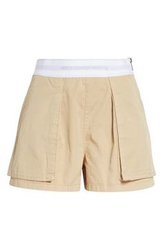 A branded elastic waistband features in tucked-in or cropped-top pairings with these cargo-influenced rave shorts cut from peached cotton twill. 3" inseam; 27" leg opening; 11" front rise; 16" back rise (size 2) Side zip closure Cargo bellows pockets; back flap pockets 100% cotton with 64% nylon, 22% polyester, 14% elastane waistband Dry clean Imported Designer Clothing Rave Shorts, Bellows, Fragrance Design, Fabric Gift Bags, Fabric Gifts, Free Fabric, Cropped Top, Alexander Wang, Cotton Twill