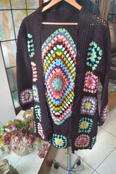 Handmade Crochet  Knit Colorful Winter  GRANNYs  sweater cardigan Measurements of this boho jacket cardigan gown : Size: Free size, i will send any size that you want Made of highest quality acrowool acrylic blend yarn Very stylish and fashionable  elegant and keeps you very warm Wash Instructions: Machine washable at low temperatures. -machine wash gentle (40 C/104 F) -tumble dry on low heat Unique designers print, handcrafted with love Great gift for yourself or for your loved ones Bohemian Multicolor Granny Square Outerwear, Cozy Multicolor Outerwear With Granny Square Detail, Bohemian Granny Square Sweater, One Size, Granny Square Cardigan Sweaters & Cardigans, Cozy Multicolor Granny Square Outerwear, Winter Gowns, Boho Jacket, Crochet Jacket, Winter Colors