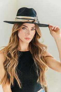 Our love of hats just got became a full-on obsession: meet the Navajo Feather Banded Hat in Black. The most chic, high-end hat we could've ever dreamed up. A hat this good needs to be worn as much as possible and with every single outfit! Hand made by artisans, incredible quality, pure suede, genuine leather trim around the crown, authentic feathers, chain, too many details to list! Will ship 8/28. The best part? It's super structured with an elastic band on the inside that will fit EVERYONE. Bt Hat Band, The Crown, Leather Trim, Hat Fashion, Elastic Band, Leather Trims, Feathers, Hand Made, Genuine Leather