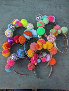 several different types of hair clips with pom - poms on top of them