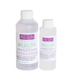 two bottles of resin cleanser sitting next to each other