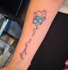 a person with a flower tattoo on their arm