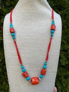 Blue Turquoise with Red Coral Necklace: Material: Gemstone Stone: Turquoise and Coral Color: Blue and Red Shape: Necklace Used for:  Wearing in a Normal Daily Routine life and any Special occasion These items are made from original and Natural Turquoise and Coral. It is handmade. Capture the essence of elegance with our Blue Turquoise with Red Coral Necklace. Handmade with care, this stunning gemstone jewelry combines the vibrant hues of blue turquoise and red coral, creating a unique piece that Red Bohemian Crystal Necklace With Colorful Beads, Red Gemstone Beads Necklaces For The Beach, Red Bohemian Beaded Necklaces With Stones, Red Gemstone Beaded Necklace For Beach, Red Gemstone Beads Necklace For Beach, Bohemian Red Beaded Necklaces With Stones, Bohemian Red Gemstone Beaded Necklaces, Red Gemstone Beaded Necklace In Bohemian Style, Bohemian Red Gemstone Crystal Necklace