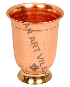 an old fashioned copper cup with writing on the side and bottom, sitting on a white background