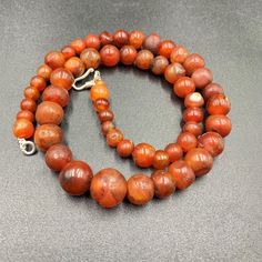 The Beautiful Roman's Era Dynasty Red Carnelian Agate Stone Jewelry Beads Necklace. The Age Of This Beads Are More Than 2000 Years Old. Conditions Of Beads As Shown In The Pictures. Rich In Patina. Polished Round Carnelian Beads, Gems, And Cabochons, Round Carnelian Beads For Jewelry Making, Carnelian Gemstone Beads Necklace, Carnelian Gemstone Beaded Necklaces, Red Carnelian Large Beads, Red Carnelian Round Beads, Carnelian Beaded Necklaces With Gemstone Beads, Round Carnelian Necklace With Polished Beads, Red Large Carnelian Beads