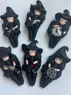 six little witches sitting on top of each other